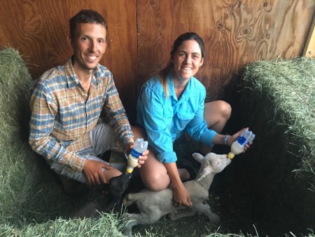 Us feeding baby lambs at Priscilla’s barn