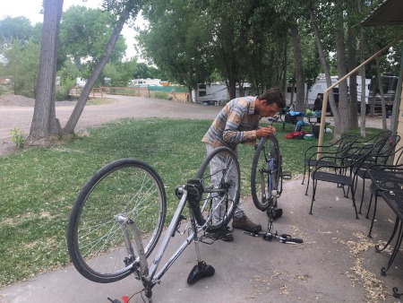 Rob picking Goat's Heads out of tires