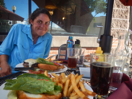 Ruth having beers and hamburgers in a brewery