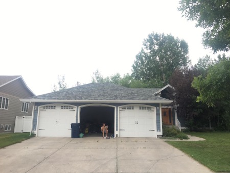 Rob reading a book in the garage of Addie's old home