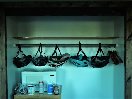The team's helmets hanging in the hotel room