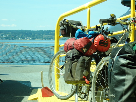 Our bikes on the ferry from Edmonds to the Olympic peninsula with views of the sea and land in front