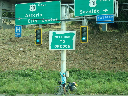 Ruth with the welcome to Oregon road sign