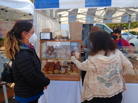 Cynthia and Ruth in market buying treats