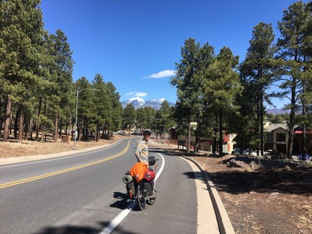 Rob on the road with the mountains in the background