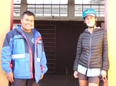 Ruth at the fire station in Dolores with one of the crew posing next to the door
