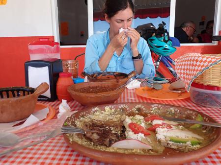 Us eating enchiladas, chile relleno and guayaba water at a great restaurant. Ruth cleaning her face in the background