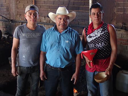 Félix and his sons in the mezcal distillery