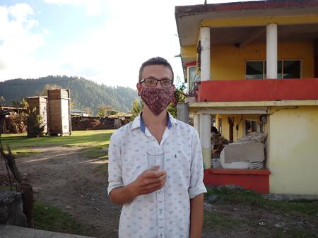 Rob trying pulque at a lady's house who made a living selling the stuff