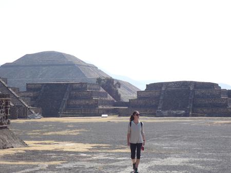 The Pyramid of the Sun in the background as Ruth strolls through the various stepped structures surrounding the Pyramid of the Moon